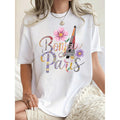 Casual Short Sleeve TShirt Featuring Bonjour Paris Graphic with Eiffel Tower and Floral Design Black Round Neck Comfortable Summer Top with Stretch Machine Washable Playful Print
